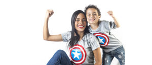 a mom and her son smiling and posing in Captain America t-shirts